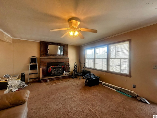 living area featuring carpet, a ceiling fan, and crown molding