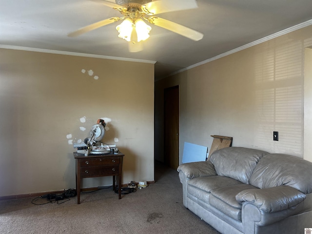 living area with carpet floors, baseboards, a ceiling fan, and crown molding