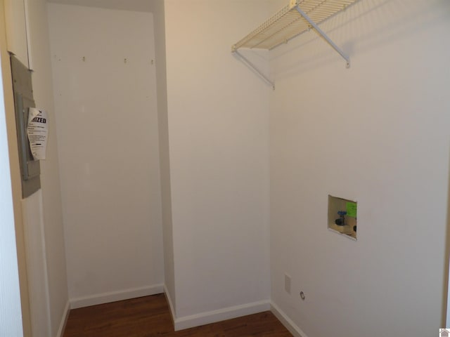 laundry room with washer hookup, laundry area, baseboards, and wood finished floors