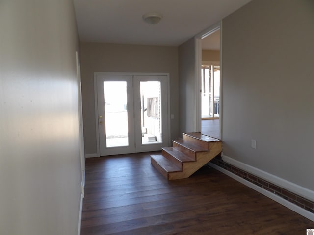 doorway to outside with french doors, stairway, dark wood finished floors, and baseboards