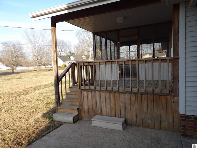 wooden deck with a lawn