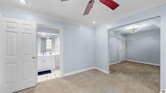 interior space with crown molding, recessed lighting, light carpet, ensuite bath, and baseboards