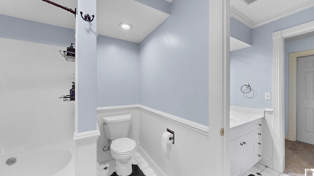 bathroom featuring vanity, toilet, and baseboards