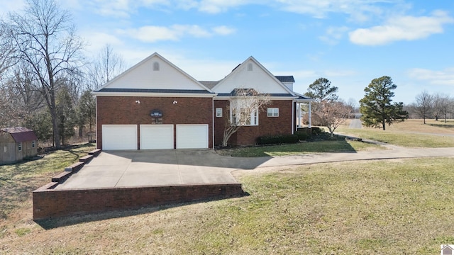 view of front facade with a garage, driveway, brick siding, and a front lawn