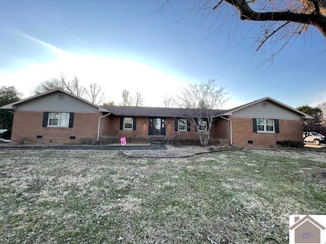 ranch-style house with crawl space, brick siding, and a front lawn