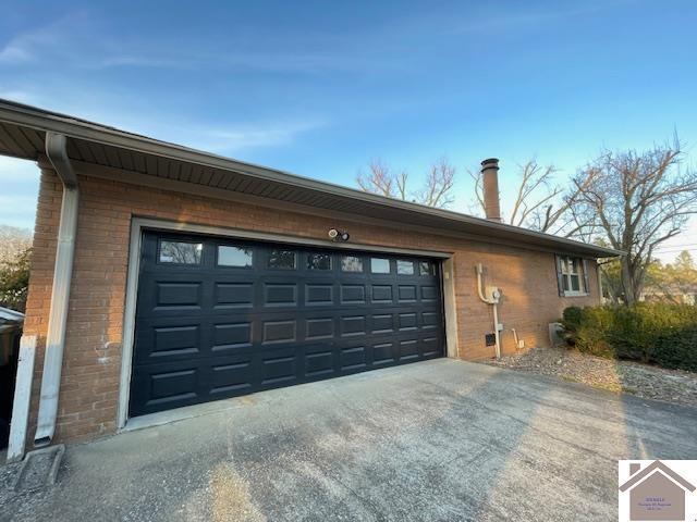 garage featuring driveway