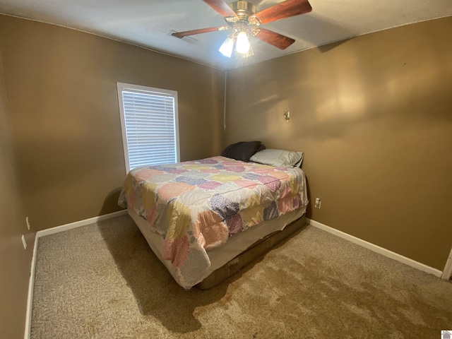 bedroom featuring carpet floors, baseboards, and a ceiling fan