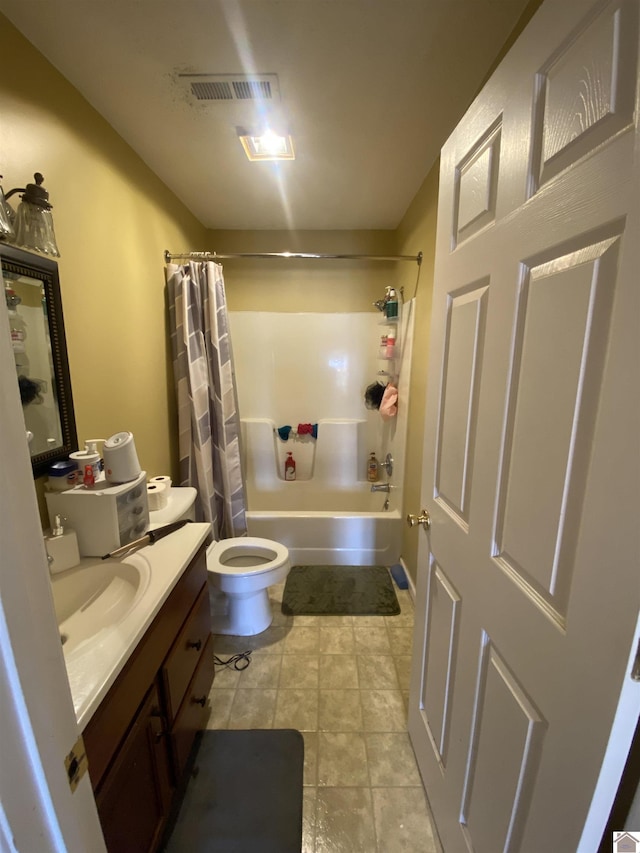 full bathroom with toilet, vanity, visible vents, tile patterned floors, and shower / bath combo