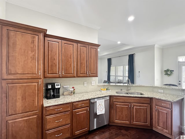 kitchen with ornamental molding, dark wood-type flooring, a peninsula, stainless steel dishwasher, and a sink