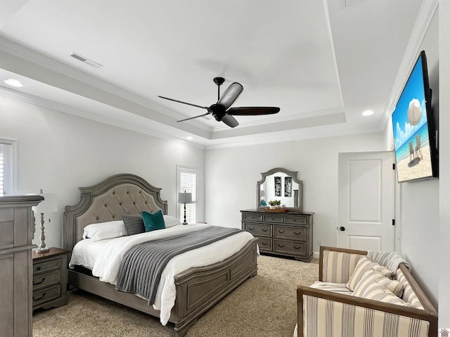 carpeted bedroom with recessed lighting, a raised ceiling, visible vents, ornamental molding, and ceiling fan