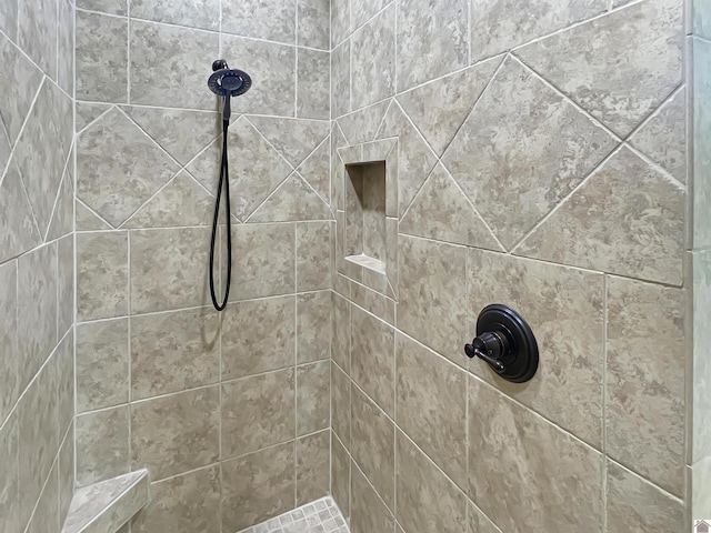 full bathroom with tiled shower