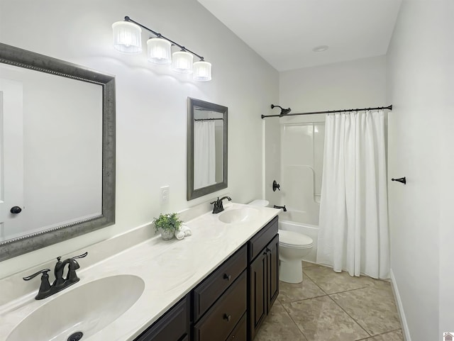 bathroom featuring toilet, shower / bath combination with curtain, double vanity, and a sink