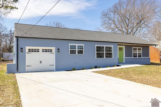 ranch-style house with a garage, brick siding, driveway, and a front lawn