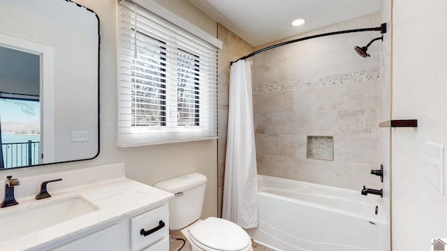 full bath with recessed lighting, vanity, toilet, and shower / bath combo with shower curtain