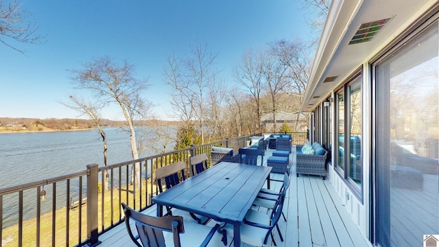 wooden terrace with outdoor lounge area, outdoor dining area, and a water view