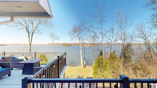 wooden terrace featuring a water view