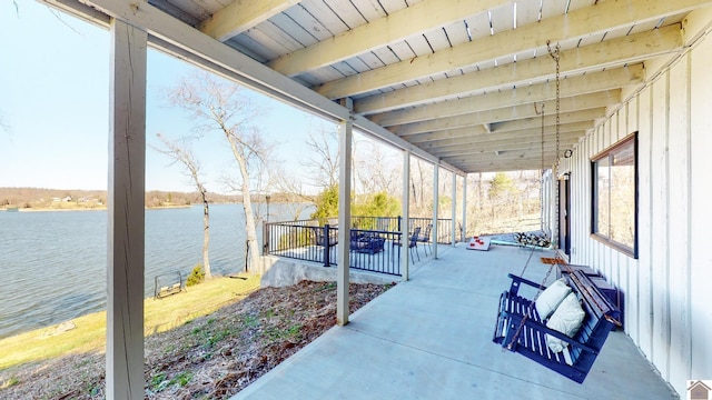 view of patio featuring a water view