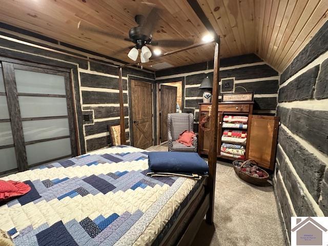 carpeted bedroom with wood ceiling and vaulted ceiling