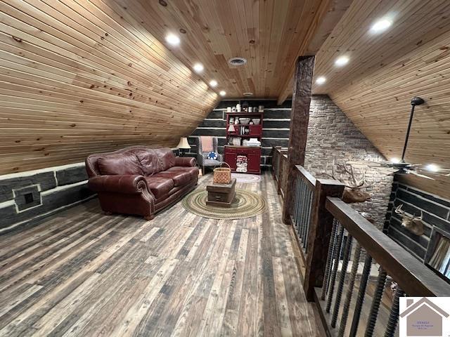 living area with lofted ceiling, wooden ceiling, recessed lighting, and wood finished floors