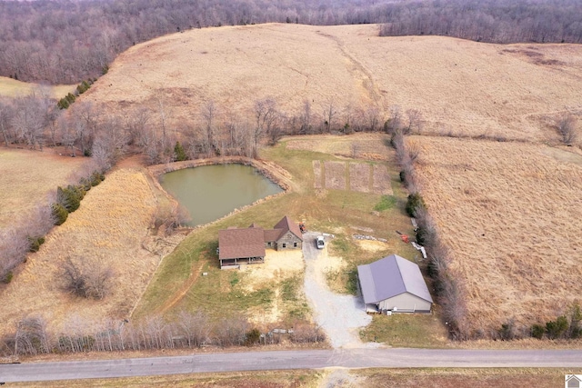 birds eye view of property featuring a rural view and a water view