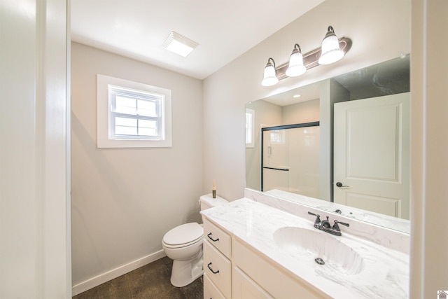 full bath featuring a stall shower, baseboards, toilet, wood finished floors, and vanity