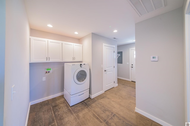 washroom with washer / clothes dryer, visible vents, cabinet space, dark wood-type flooring, and baseboards