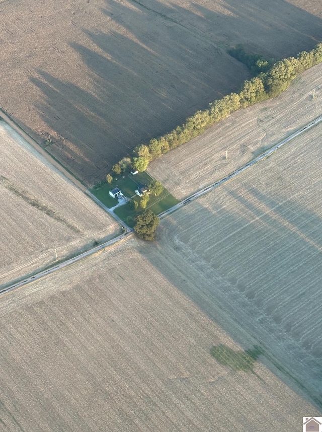 birds eye view of property with a rural view