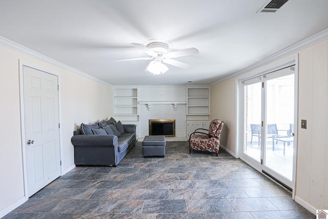 living area featuring ornamental molding, stone finish flooring, and visible vents