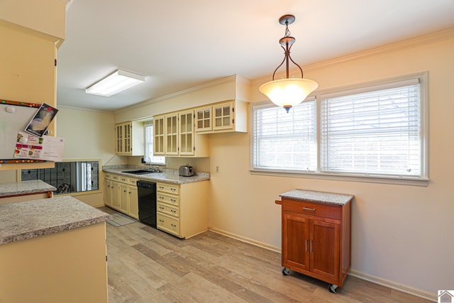 kitchen featuring ornamental molding, light wood-type flooring, dishwasher, and a sink