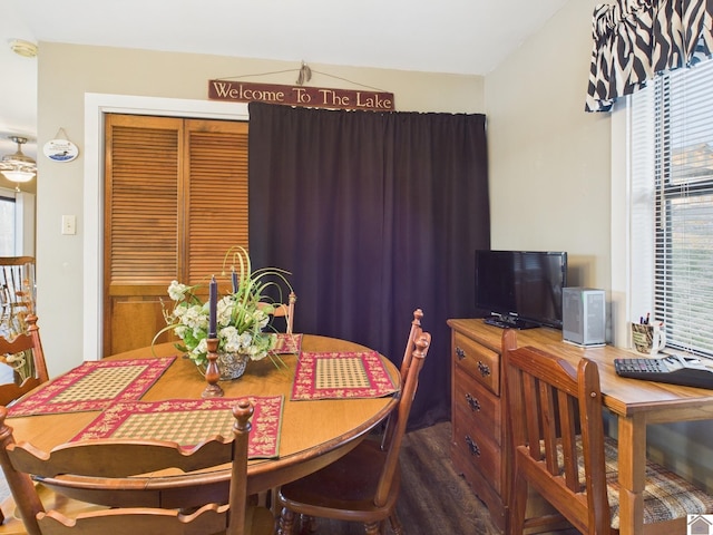 dining space featuring dark wood-style floors