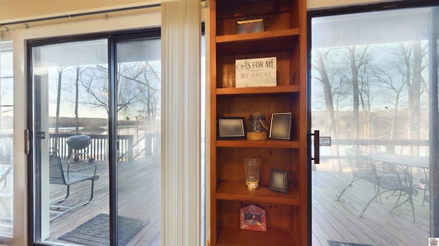 entryway featuring built in shelves