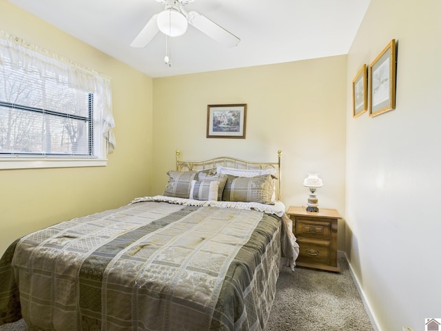 bedroom featuring ceiling fan, carpet floors, and baseboards