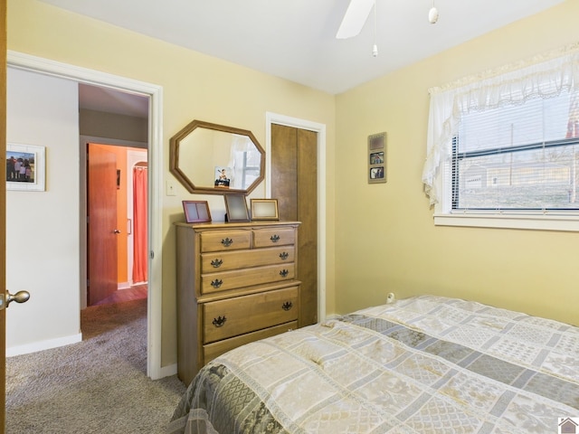 bedroom featuring ceiling fan, baseboards, and carpet flooring