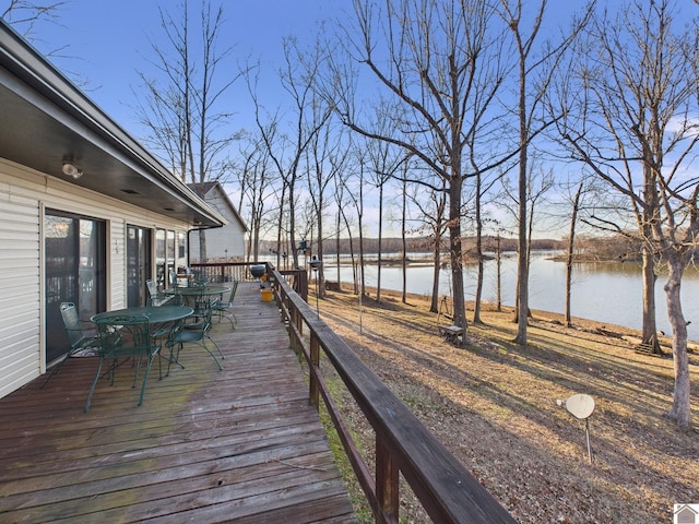 wooden deck featuring a water view