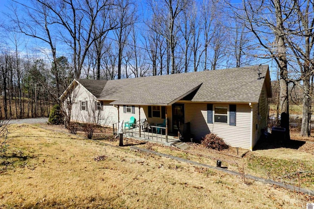 view of front of house featuring roof with shingles