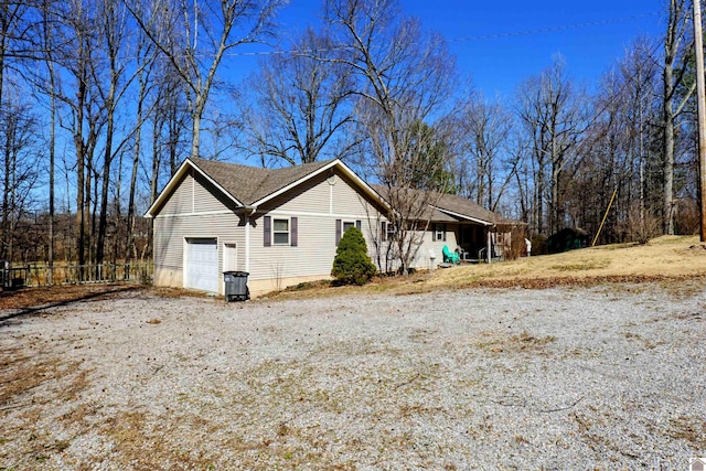 view of property exterior with a garage