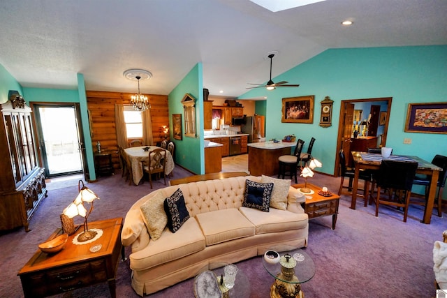 living area featuring recessed lighting, light colored carpet, vaulted ceiling, and ceiling fan with notable chandelier