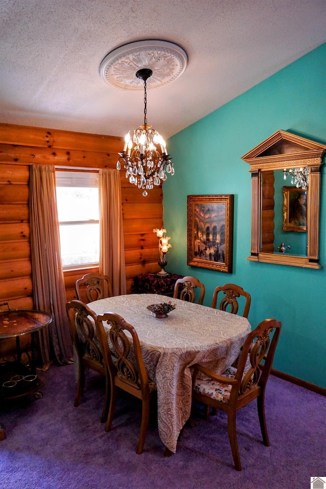 carpeted dining area featuring a textured ceiling, a chandelier, log walls, and baseboards