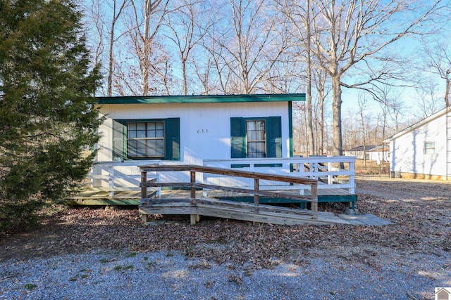 view of front of property featuring a wooden deck