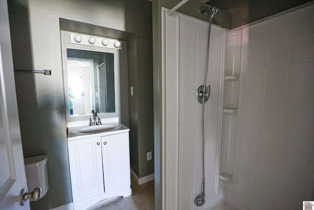 full bath with a shower and vanity