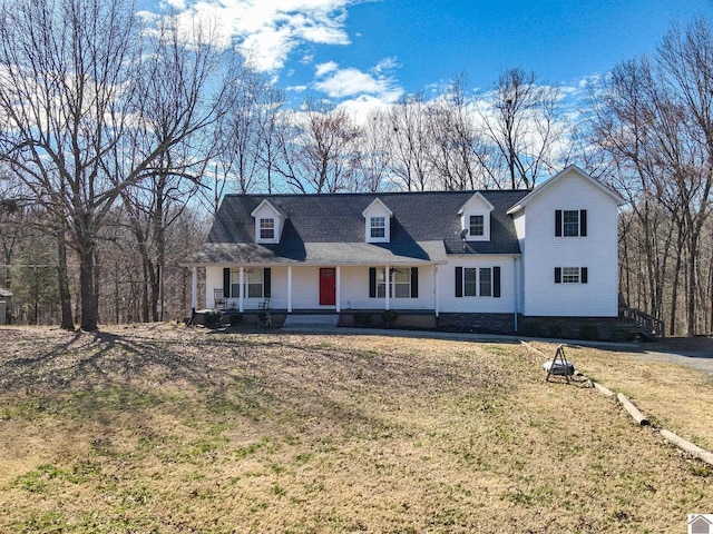 view of front of house featuring covered porch and a front lawn