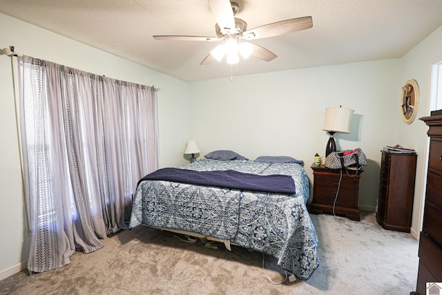 3929 Griggstown Rd, Calvert City, KY 42029 - carpeted bedroom with a ceiling fan, a textured ceiling, and baseboards
