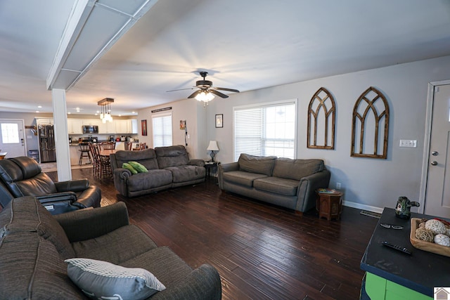 3929 Griggstown Rd, Calvert City, KY 42029 - living area featuring dark wood-style floors, baseboards, and a ceiling fan