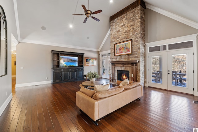 living area featuring a fireplace, crown molding, dark wood-type flooring, high vaulted ceiling, and baseboards