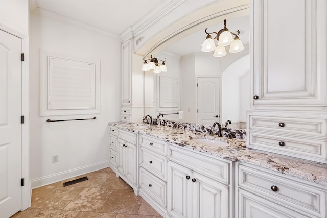 bathroom featuring double vanity, visible vents, a sink, and ornamental molding