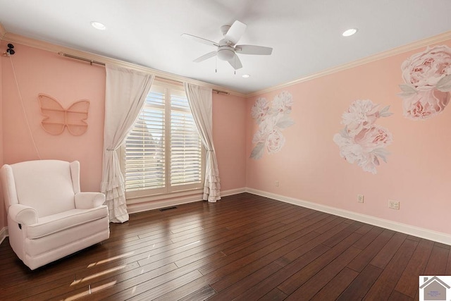 unfurnished room featuring visible vents, baseboards, hardwood / wood-style flooring, and crown molding