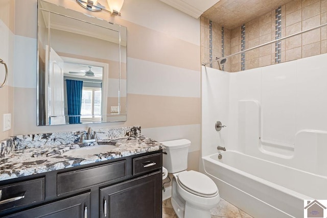 bathroom featuring bathtub / shower combination, ceiling fan, vanity, and toilet