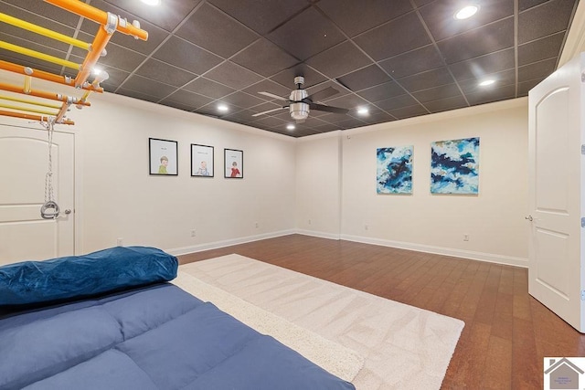 bedroom featuring a paneled ceiling, baseboards, wood finished floors, and recessed lighting