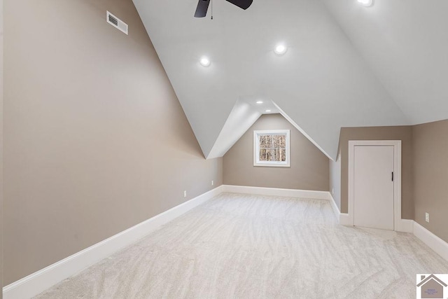 additional living space featuring baseboards, visible vents, lofted ceiling, carpet, and recessed lighting