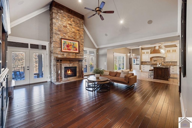 living area featuring plenty of natural light, a fireplace, and hardwood / wood-style floors